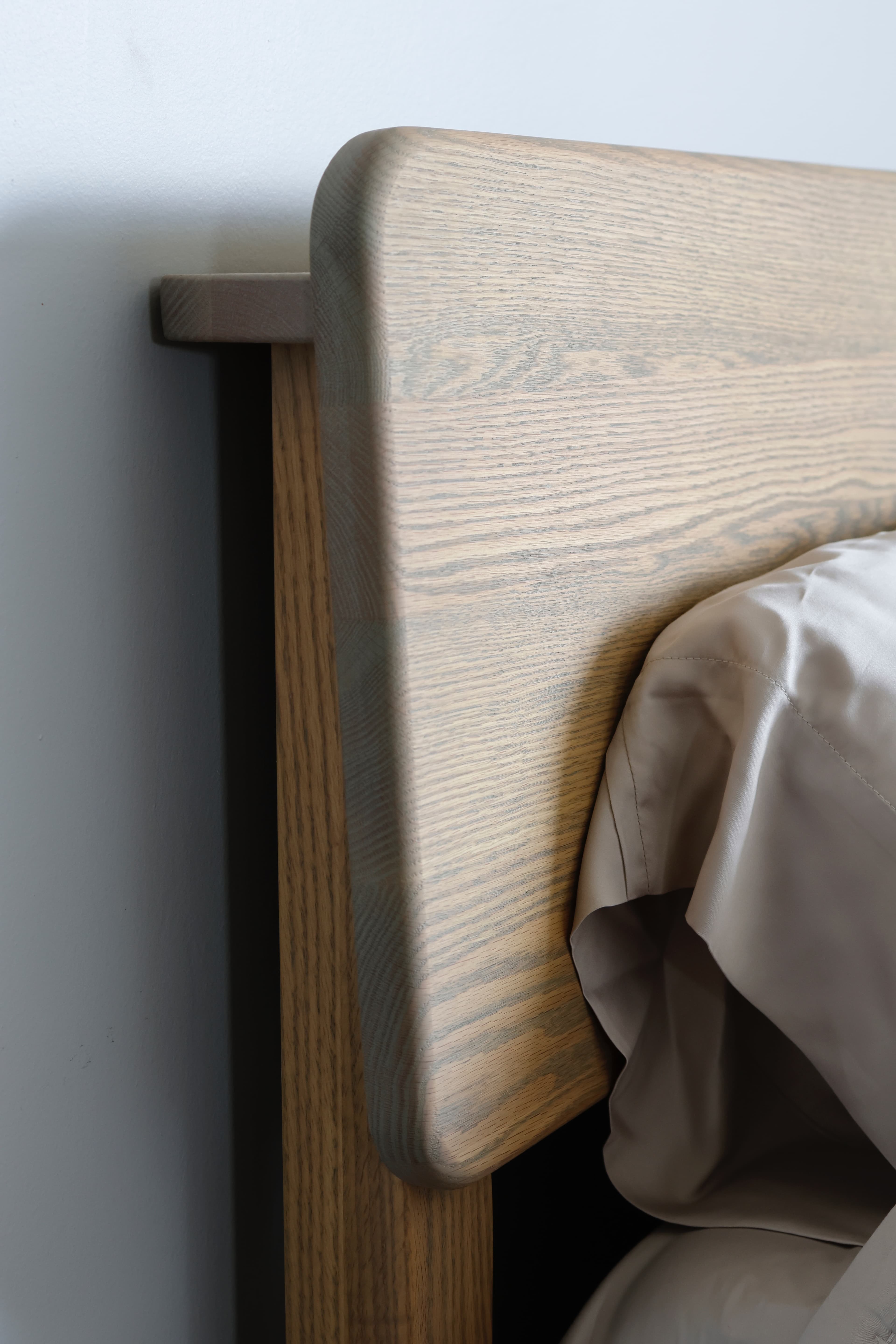 Close-up of a solid oak bed frame